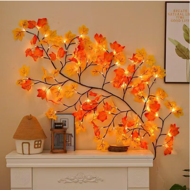 FabAmberLeaf™ Maple Leaf LED Branch Wall Light displayed above an indoor cabinet