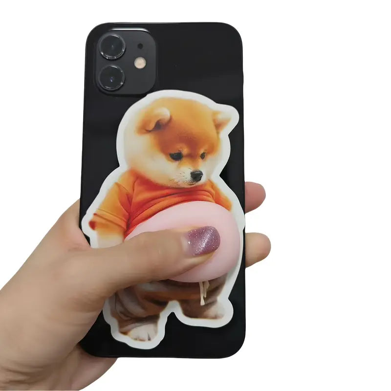 Shiba Inu belly sticker being pressed on a phone case