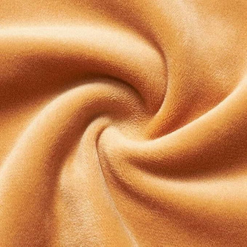 Close-up of brown fabric with a swirling pattern